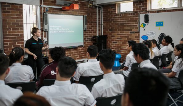 Digital Thumbprint Program facilitator presenting a workshop to students in a classroom.