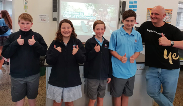 regional-devonport-tas-593x344-1 Digital Thumbprint Program facilitator presenting a workshop to students in a classroom.