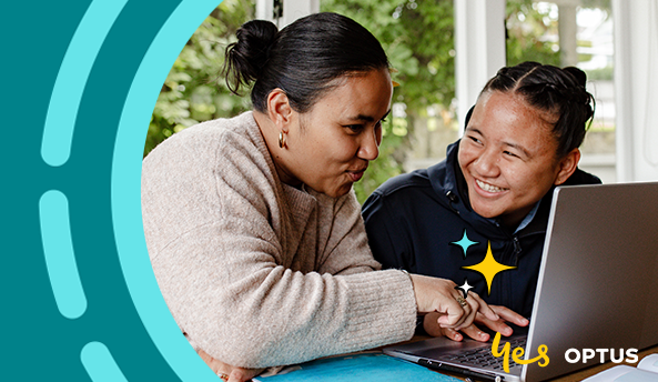 Two women working with a laptop